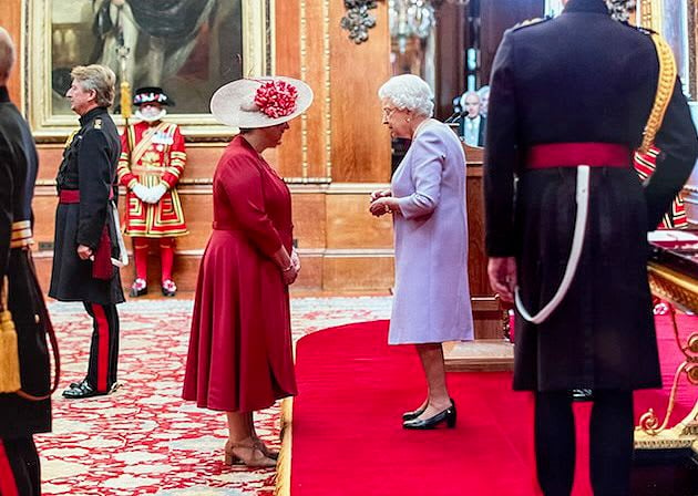 Katherine Horler receiving her OBE from Her Majesty Queen Elizabeth II